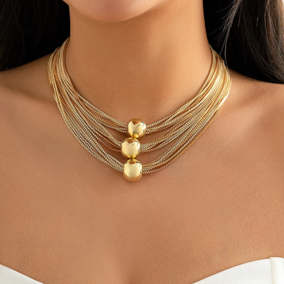 Nocturne draperat halsband med bollar
