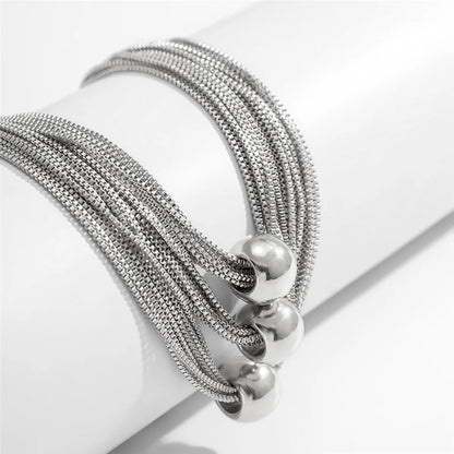 Nocturne draperat halsband med bollar
