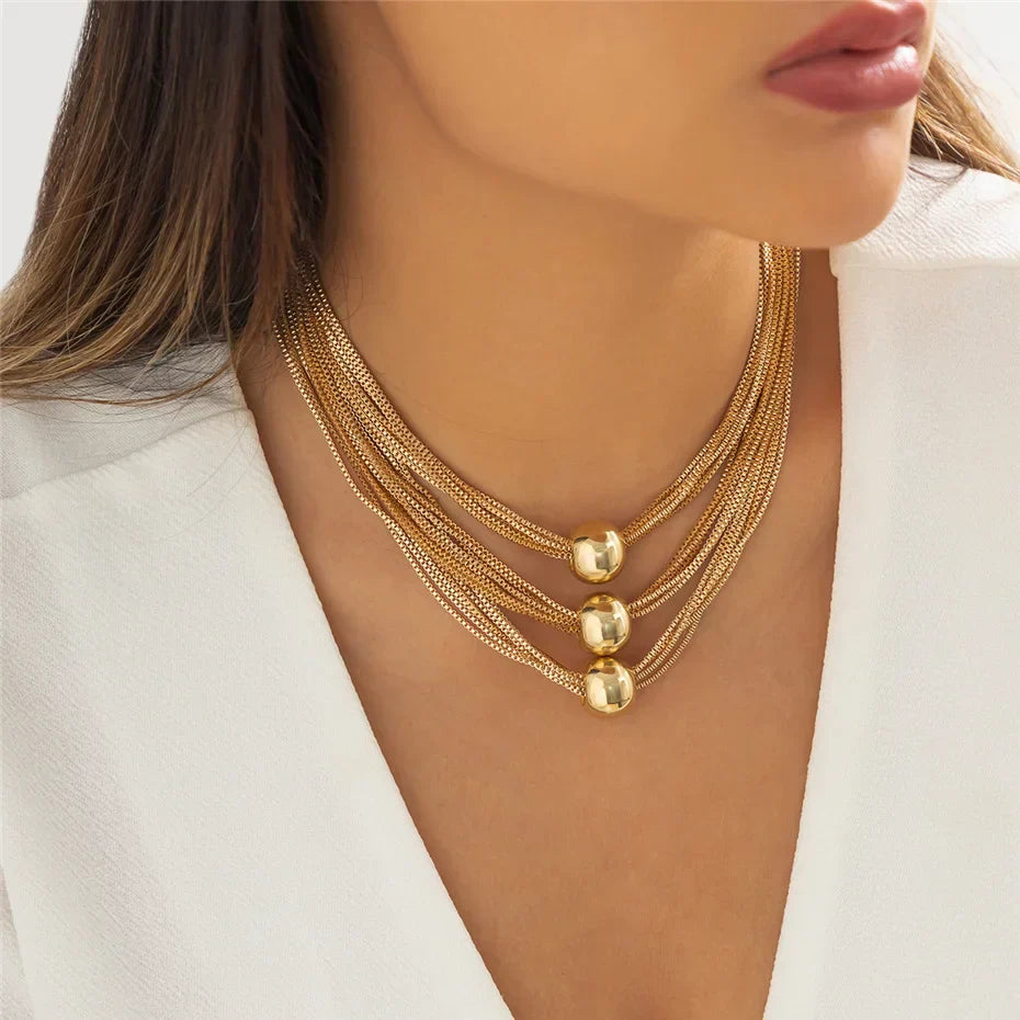 Nocturne draperat halsband med bollar